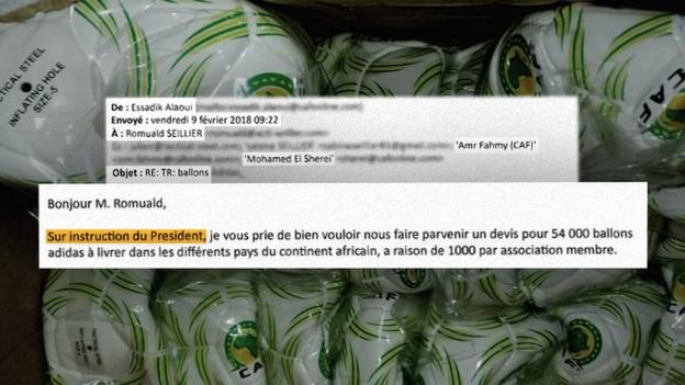 Excerpts of an email from Caf to Tactical Steel owner Romuald Seillier, with some of the 60,000 footballs in the background