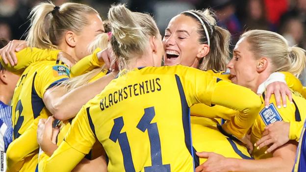 Sweden's players celebrate scoring against Japan at the Women's World Cup