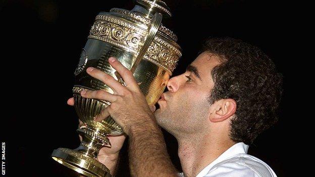 hollywood Pete Sampras kisses the Wimbledon trophy in the darkness of Centre Court