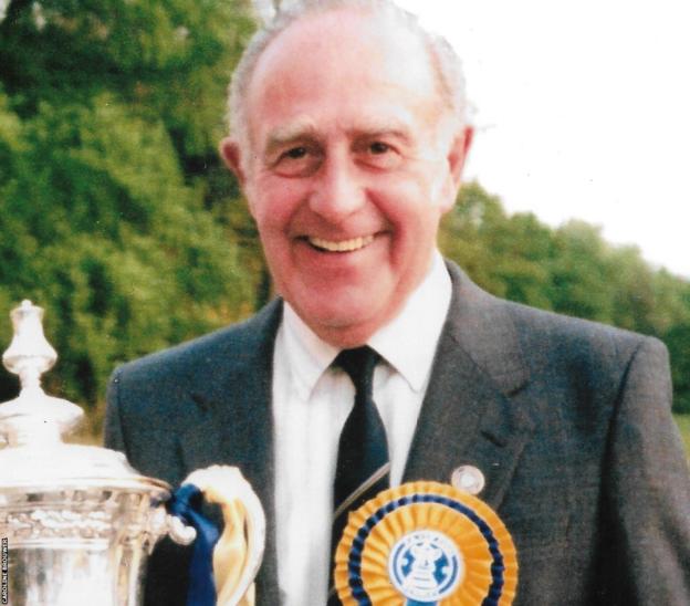 Caroline Brouwer's father Thom poses with the FA Cup