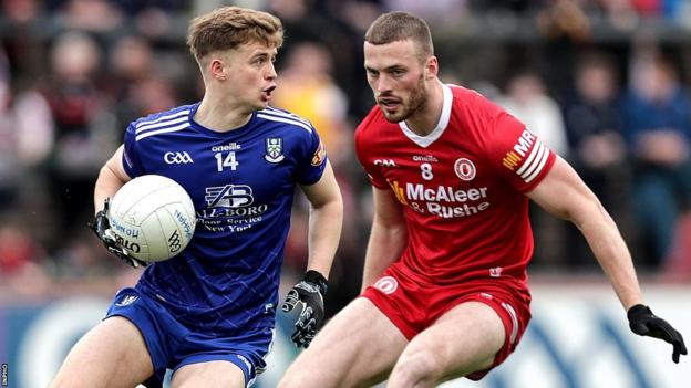 Monaghan's Karl Gallagher attempts to get past Tyrone's Brian Kennedy