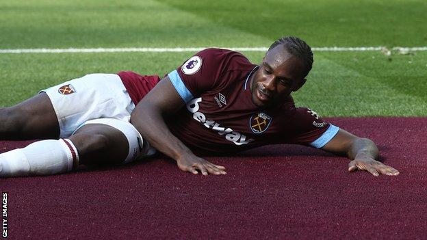 West Ham winger Michail Antonio lies down on a new claret section surrounding the pitch to celebrate his opening goal