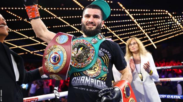 Artur Beterbiev celebrates with his 3  satellite   titles