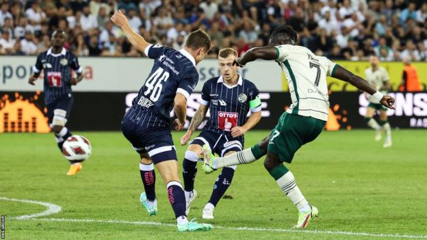 Hibernian's Elie Youan scores to marque   it 1-0 during a UEFA Conference League Qualifier betwixt  FC Luzern and Hibernian astatine  the Swissporarena,