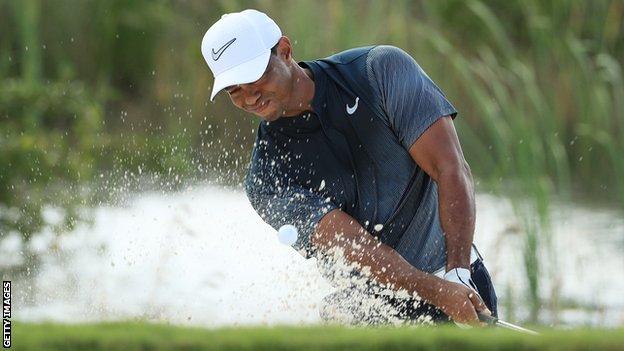 Tiger Woods plays out of a bunker at the Hero World Challenge