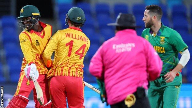 Zimbabwe's Wesley Madhevere and Sean Williams collide in the middle of the pitch against South Africa in the ICC Men's T20 World Cup