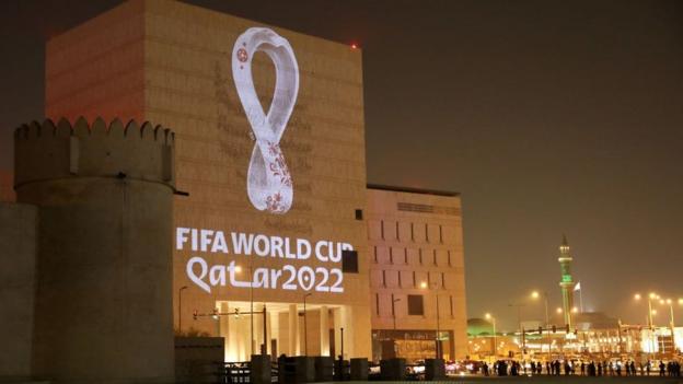 The 2022 World Cup logo projected onto a building in Qatar