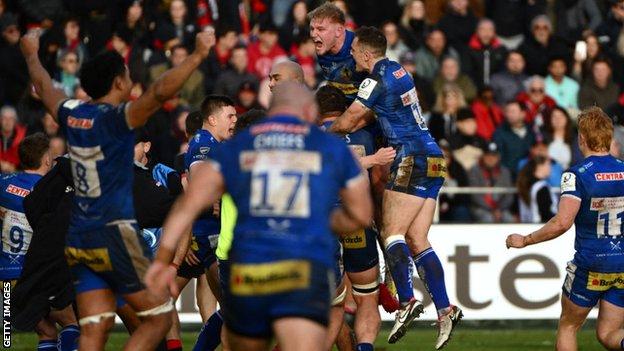 Exeter players celebrate