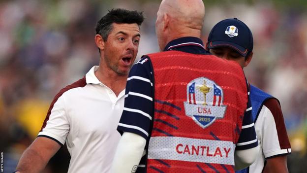 Rory McIlroy confronts Patrick Cantlay's caddie on the 18th green