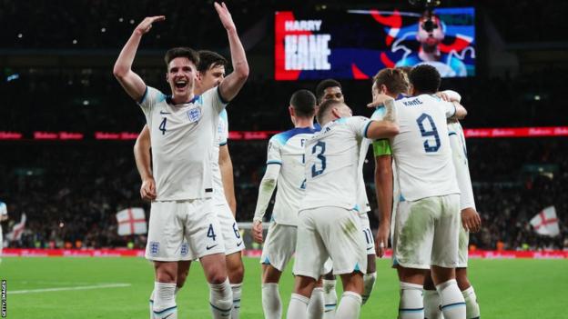 England players celebrate scoring against Italy