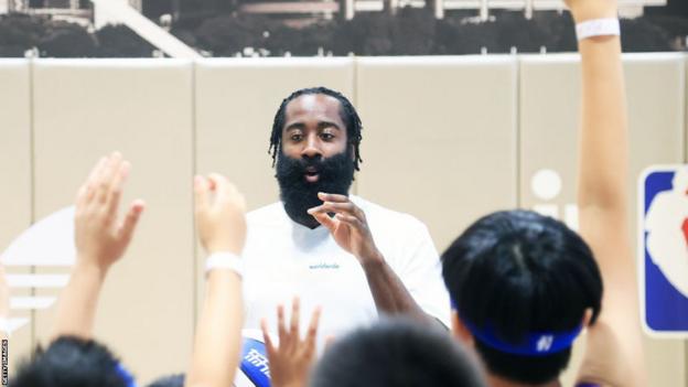 James Harden of the Philadelphia 76ers speaks to students during his China tour