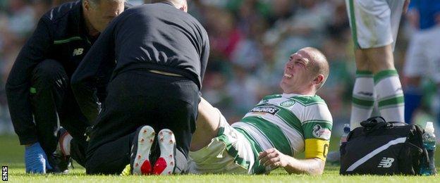 Scott Brown grimaces following a heavy tackle