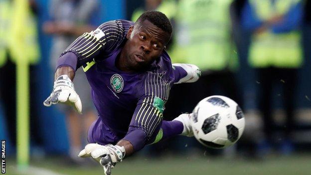 Nigeria goalkeeper Francis Uzoho dives to make a save