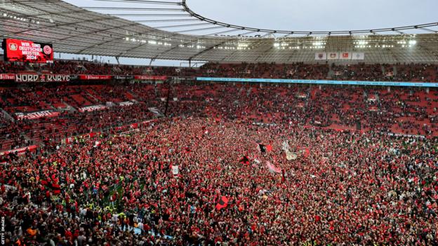 Thousands of Bayer Leverkusen fans celebrated on the pitch after the club was crowned Bundesliga champions for the first time