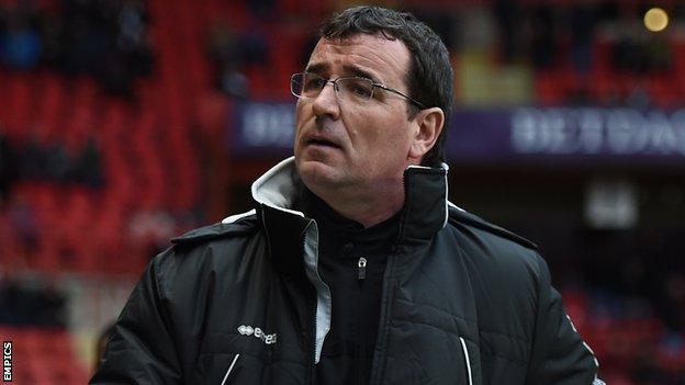 Blackpool manager Gary Bowyer looks up at the stands ahead of his side's game at Charlton