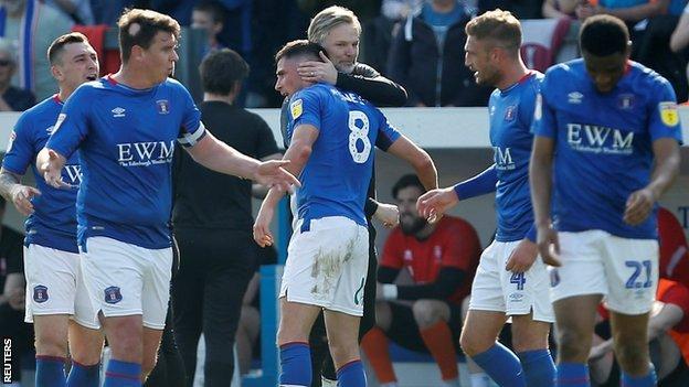 Mike Jones hit the second-half winner for Steven Pressley's Carlisle in their late season win over League Two champions Lincoln City