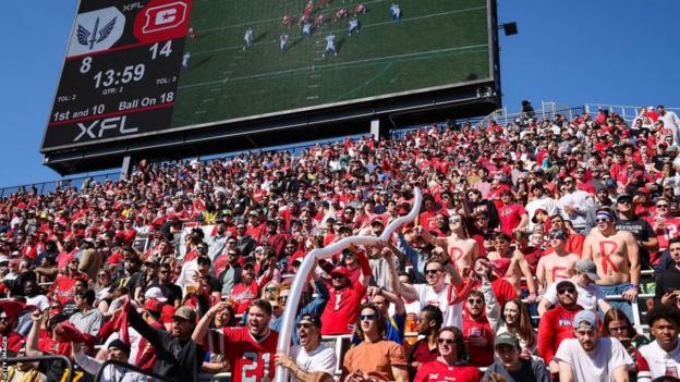 DC Defenders fans hold 'beer snakes' at 2023 XFL game