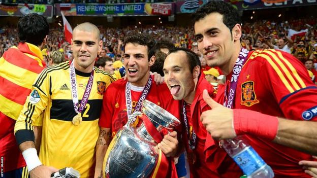 Sergio Busquets (right) with Victor Valdes, Cesc Fabregas and Andres Iniesta with the Euros trophy in 2012
