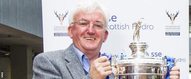 Hugh Dan MacLennan with the Camanachd Cup