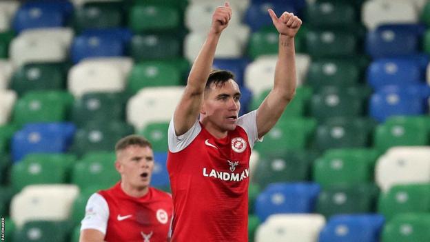 Joe Thompson celebrates scoring Larne's second goal against Linfield on Saturday evening