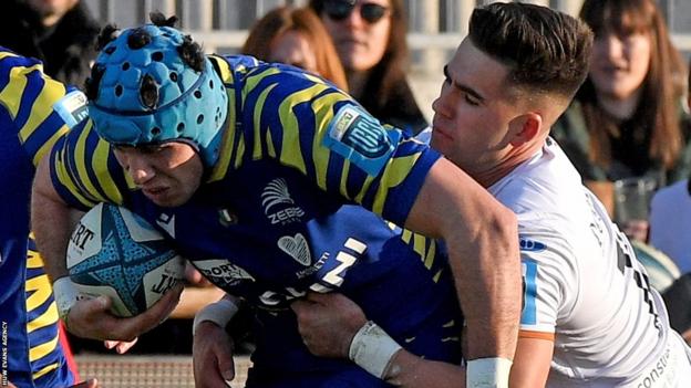 Luca Andreani of Zebre is tackled