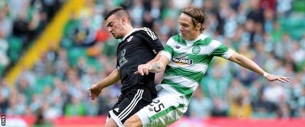 Celtic's Stefan Johansen (right) tackles Gara Garayev