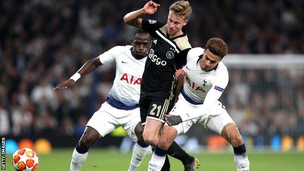 Ajax midfielder Frenkie de Jong holds off a challenge from Tottenham's Dele Alli