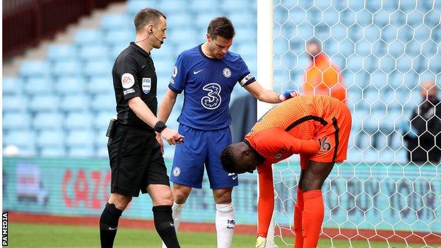 Edouard Mendy appears injured during Chelsea's 2-1 Premier League defeat at Aston Villa