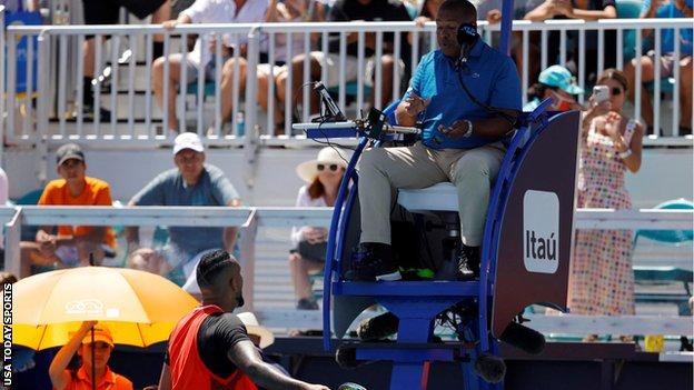 Nick Kyrgios argues with umpire Carlos Bernardes