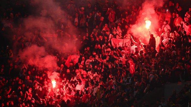 Tunisia fans celebrate their goal against Brazil