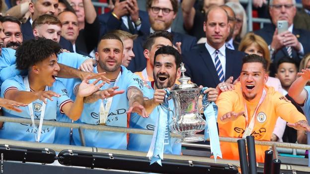 Ilkay Gundogan of Manchester City celebrates with the trophy after the FA Cup final