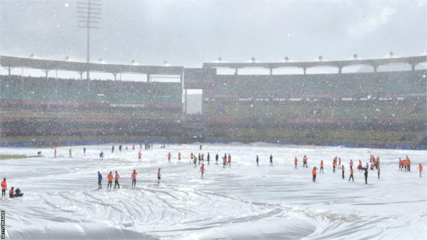 The Barsapara Cricket Ground in Guwahati covered in sheets because of rain