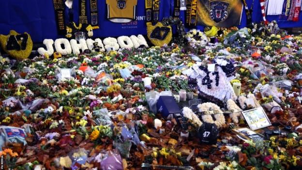 Floral tributes to Adam Johnson outside Nottingham's Motorpoint Arena