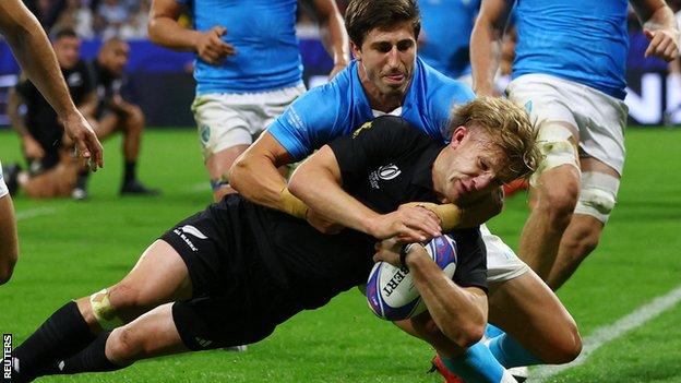 Damian McKenzie scores against Uruguay