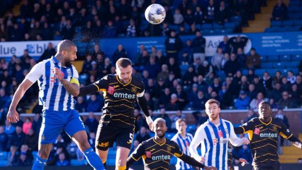 Kyle Vassell heads in Kilmarnock's third goal