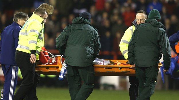 Britt Assombalonga is carried off on a stretcher after being injured in the win over Wigan Athletic in February
