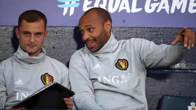 Shaun Maloney and Thierry Henry in the dugout with Belgium