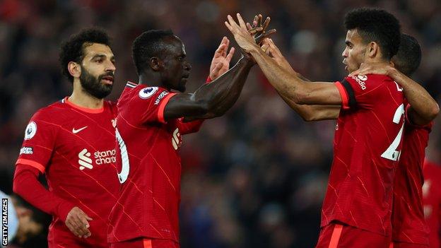 Mohamed Salah, Sadio Mané and Luis Diaz celebrate Liverpool scoring against Manchester United
