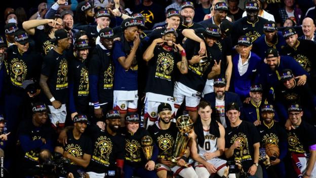 Denver Nuggets pose for a team photo after winning the NBA title