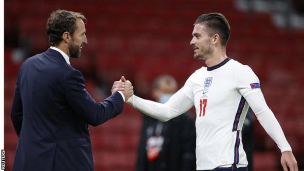 Jack Grealish (right) and England boss Gareth Southgate