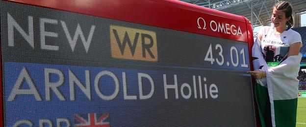 Hollie Arnold looks at the scoreboard confirming her world record at the Rio Paralympics
