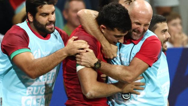 Portugal celebrate a try against Fiji