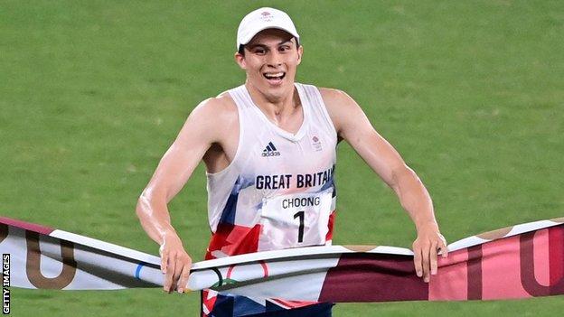 Team GB's Joe Choong crosses the line to win modern pentathlon gold at the Tokyo Olympics