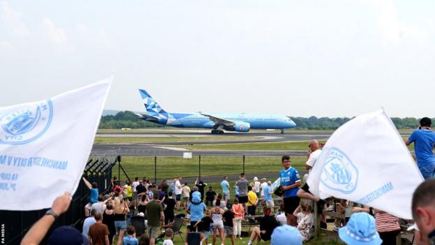 Manchester City's plane touches down at Manchester Airport