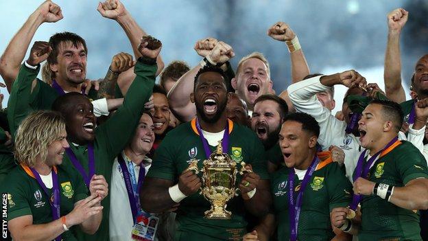 Siya Kolisi with the World Cup trophy