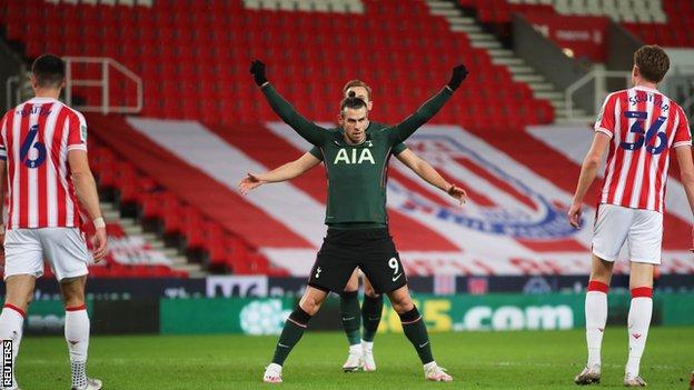 Gareth Bale celebrates after giving Tottenham the lead against Stoke City in the Carabao Cup