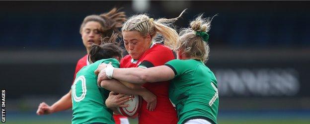 Wales' Kelsey Jones is tackled by Ireland players