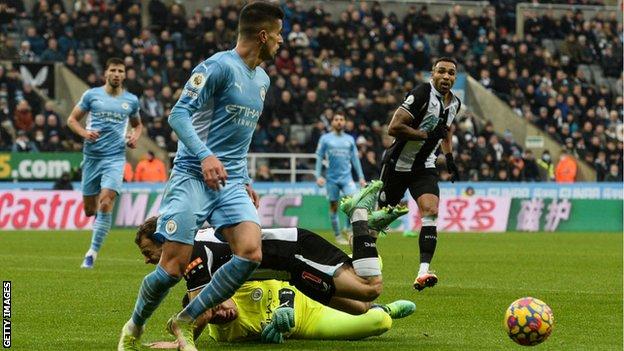 Newcastle's Ryan Fraser is brought down by Ederson in Sunday's defeat to Manchester City