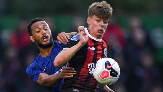 Evan Ferguson of Bohemians in action against Lewis Baker of Chelsea