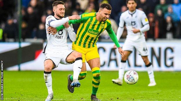 Matt Grimes battles with Hal Robson-Kanu